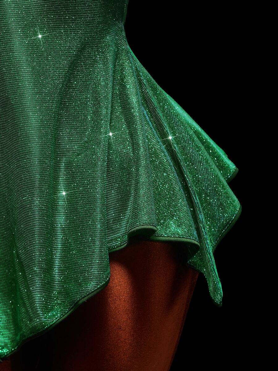 Close-up of glittering green handkerchief hem on fairy costume dress