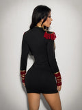 Back view of black fitted military costume mini dress with red cuffs and epaulettes