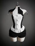 Black and white jester costume top and black ruffled shorts on mannequin