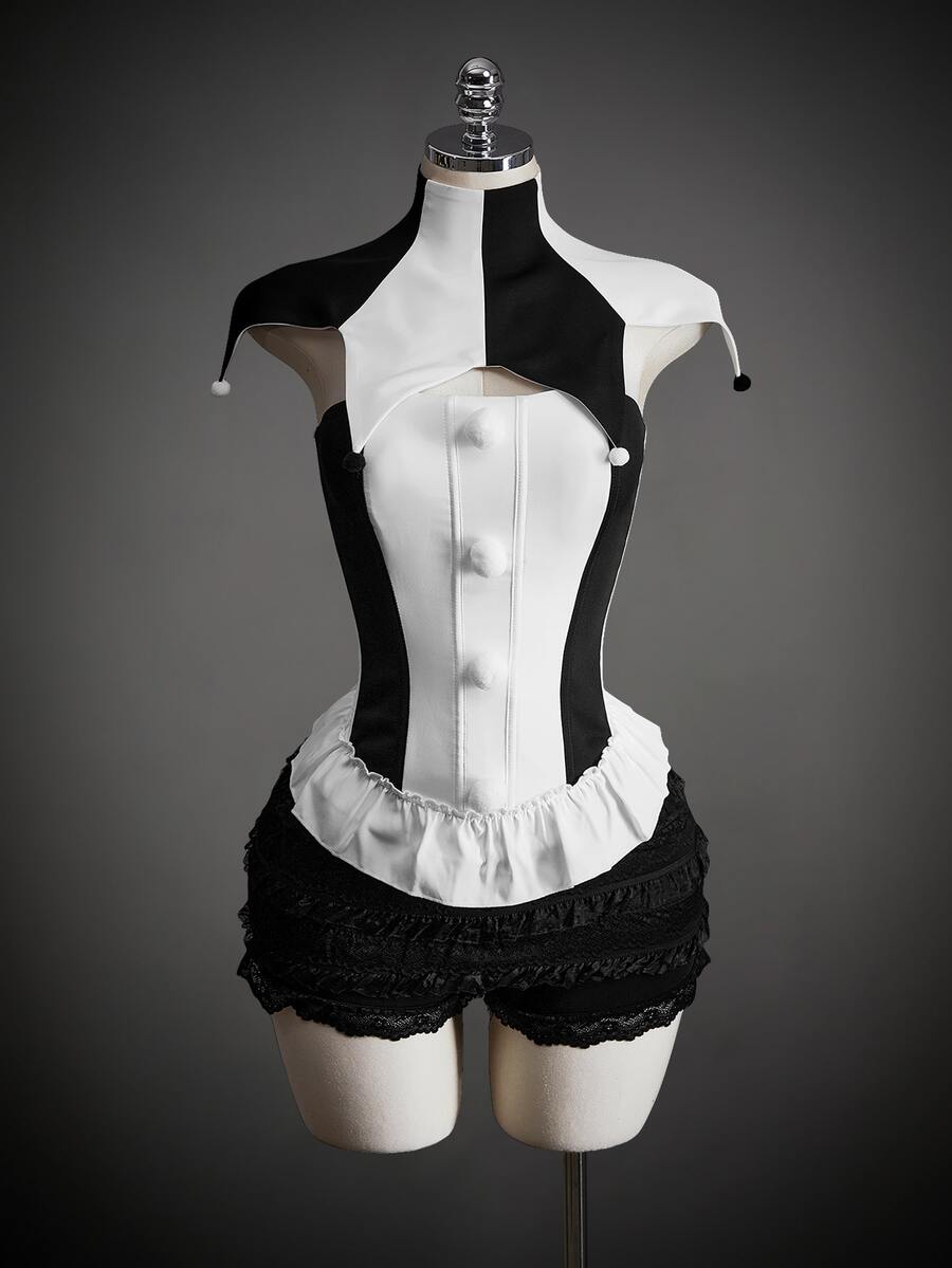 Black and white jester costume top and black ruffled shorts on mannequin