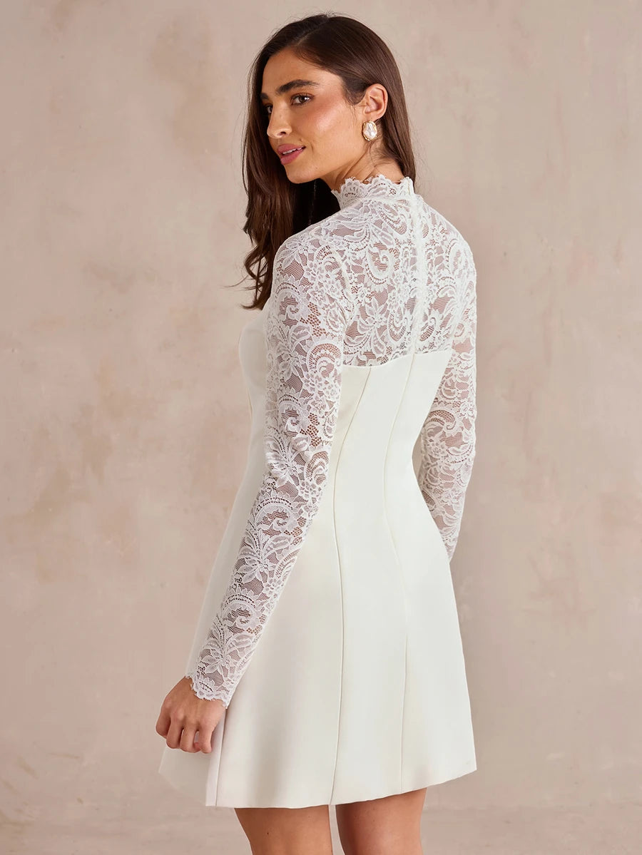 Make a graceful entrance in this ivory lace sleeve mini dress, shown across the image set with a softly flared A-line skirt and a neatly fitted bodice.