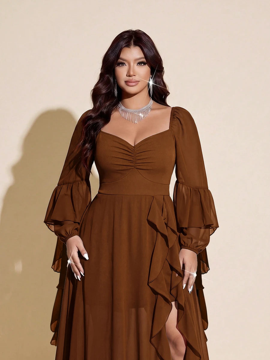 Close view of brown dress bodice showing sweetheart neckline, gathered ruching and long sheer sleeves