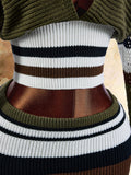 Close view of ribbed white striped waist and olive knit mini skirt waistband