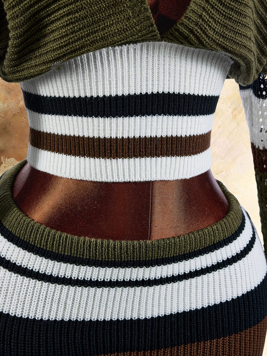 Close view of ribbed white striped waist and olive knit mini skirt waistband