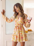 Pastel floral tiered mini dress with lace trim and flounced hem