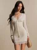 Front view highlighting the deep V-neck lace trim, button placket and fitted ivory knit dress