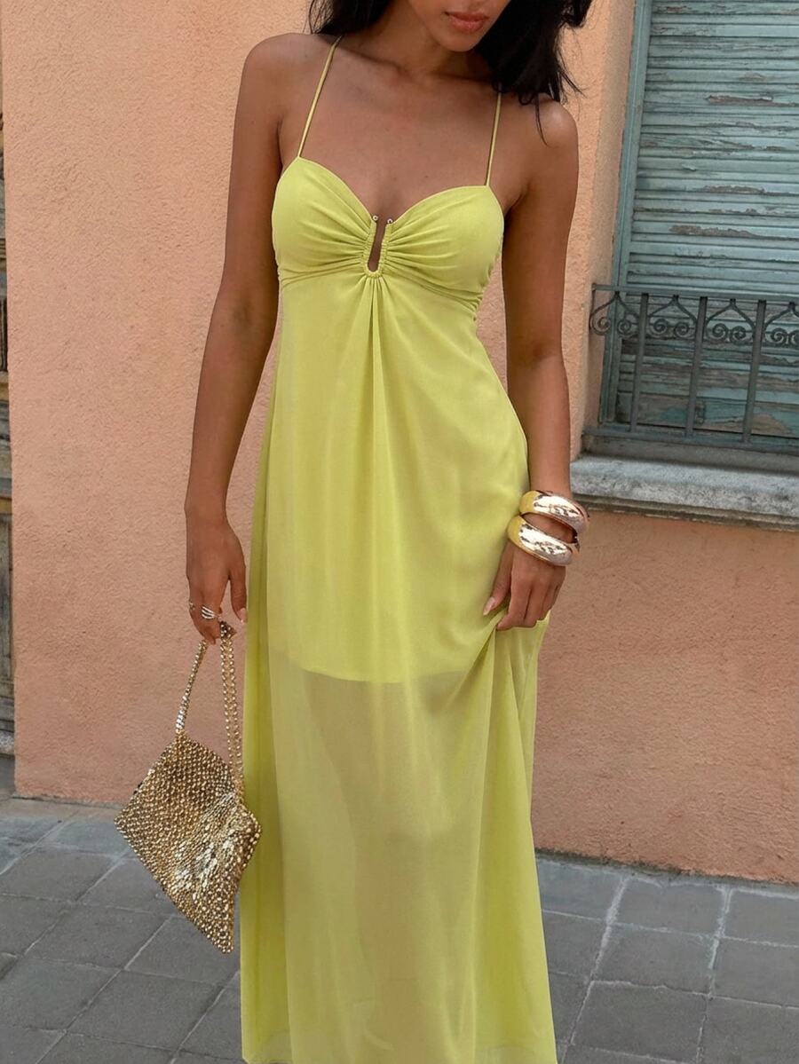 Close front view of olive green keyhole gathered bodice maxi dress outdoors