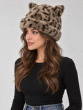 Angled model view of taupe leopard-print plush beanie with pointed cat ears