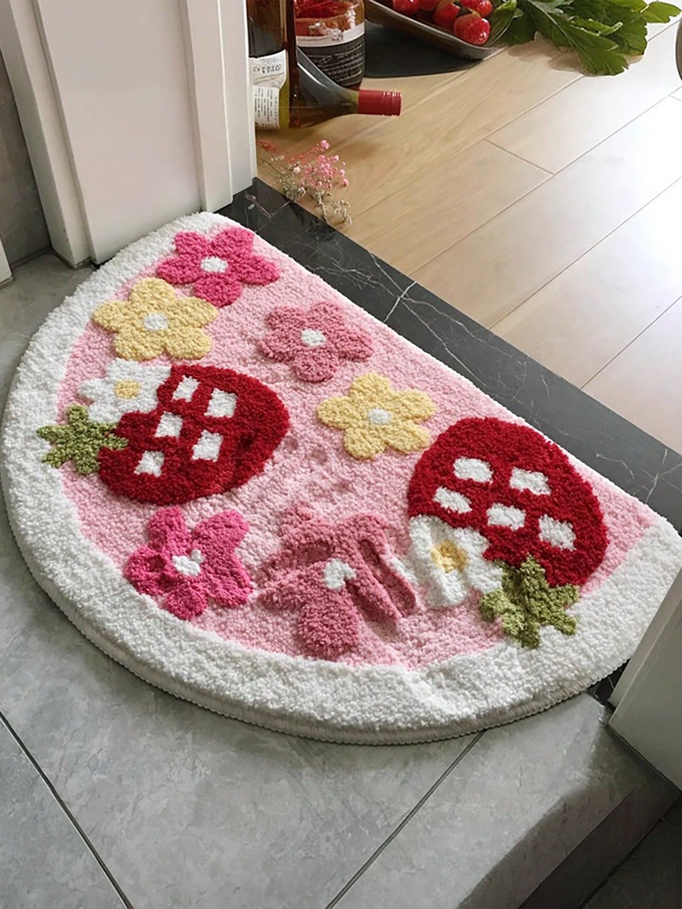 Add a splash of fun to your space with this adorable strawberry-shaped bath mat! Soft and plush underfoot, it keeps you cozy while its anti-slip backing ensures safety. Easy to wash and stylish enough for any room, this charming mat brightens your home with a juicy pop of color and comfort.
