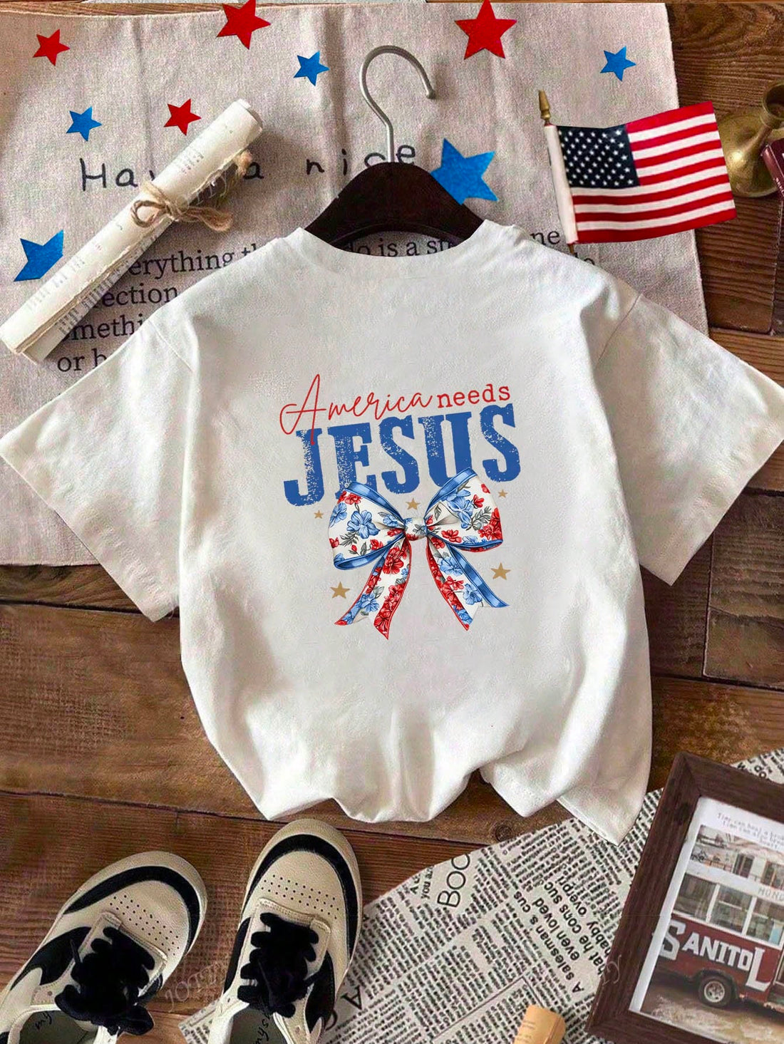 Celebrate Independence Day in style with this playful American Flag Cross Print Short Sleeve T-Shirt. Featuring a bold cross design adorned with the stars and stripes, it’s the perfect way to show your patriotic spirit. Lightweight and comfortable, this tee keeps you cool while you enjoy fireworks, barbecues, and all your 4th of July festivities. Add a fun twist to your holiday wardrobe and stand out with this festive, eye-catching shirt!