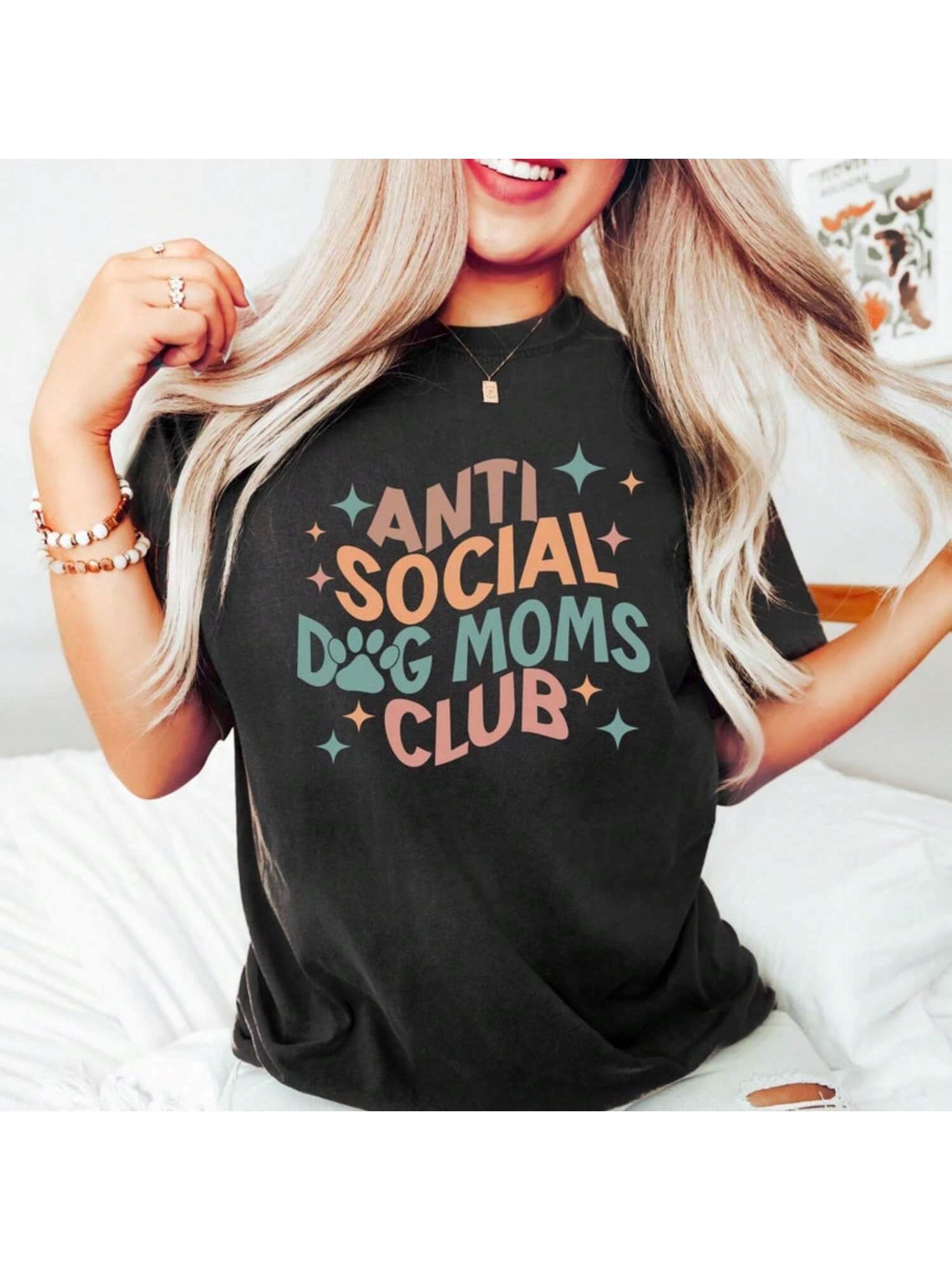 Join the exclusive Anti-Social Dog Moms Club with this perfect gift for proud dog moms! This quirky shirt is a must-have for all dog owners who love their fur babies but also value their alone time. Show off your unique sense of humor and bond with other dog moms with this playful shirt.