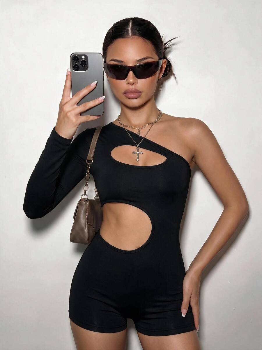 Front view of black asymmetrical one-sleeve cutout unitard romper