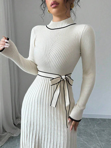 Embrace the season in effortless style with this chic knit dress that's equal parts cozy and sophisticated. The flared silhouette creates a flattering, graceful flow, while the crisp stand collar and long sleeves deliver that perfect autumn vibe. Minimalist design means it pairs beautifully with everything in your closet—dress it up with heels or keep it casual with sneakers. Soft, breathable knit fabric makes it your new go-to for those in-between weather days when you want to look polished without trying 