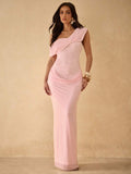 View 1 of baby pink lace one shoulder maxi dress with asymmetric neckline, draped overlay, fitted bodice, and sheer skirt