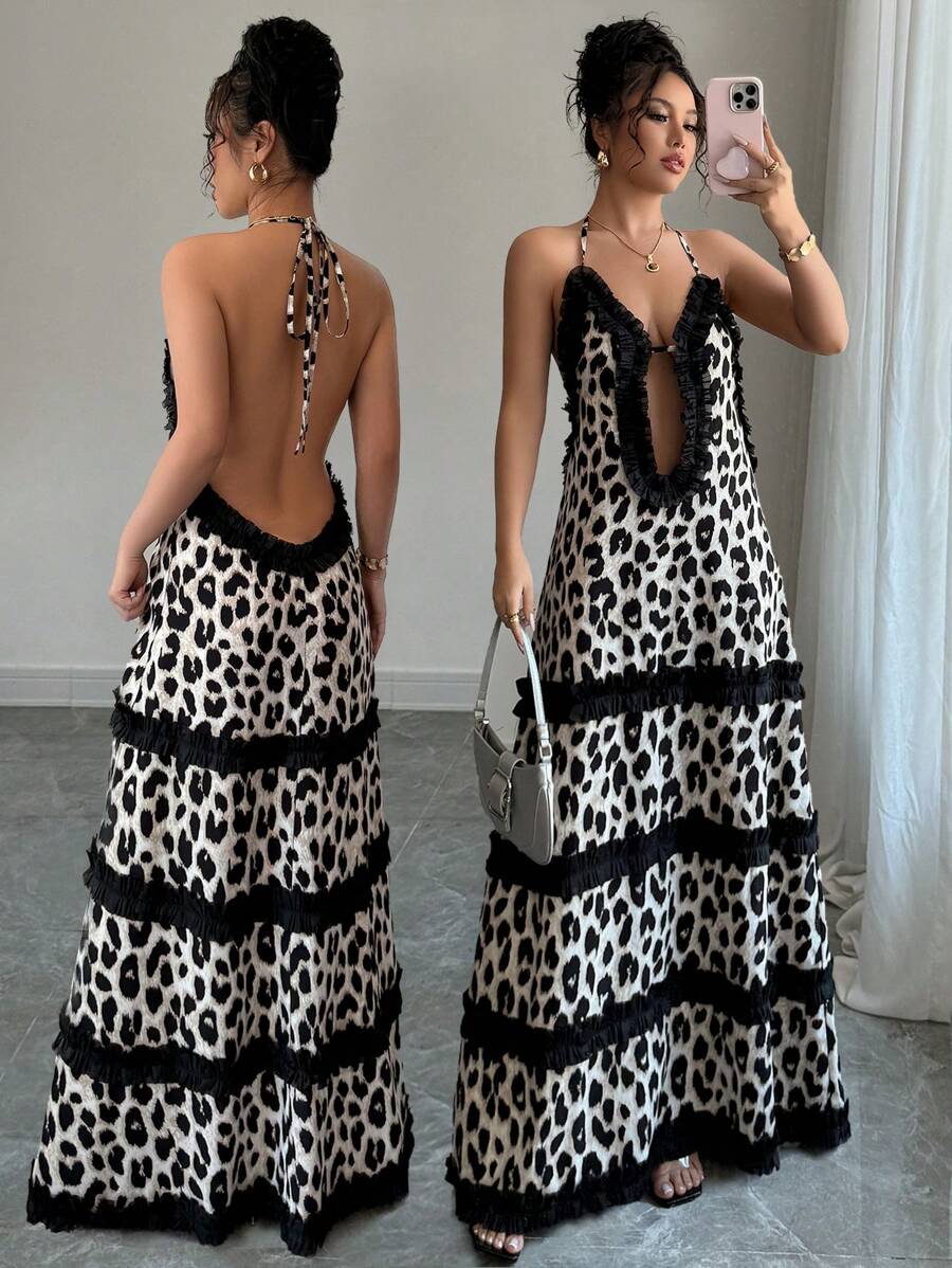 Turn heads at the beach with this stunning backless dress featuring a bold black leopard print that's equal parts wild and sophisticated. The delicate lace trim adds a touch of elegance, while the daring open back design keeps things flirty and fun. Perfect for making a statement by the water or transitioning from sand to sunset cocktails. This piece proves you don't need much fabric to make a major fashion impact.