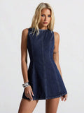 Front studio view of dark indigo sleeveless denim mini dress with sculpted seams and A-line skirt