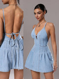 Composite front and rear view of light-wash tie-back denim mini dress with pleated skirt