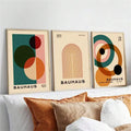Refresh your home with the timeless charm of this Bauhaus canvas wall art set. Inspired by iconic mid century design, each piece features bold geometric shapes, earthy tones, and balanced compositions that bring warmth and artistic character to any room. The clean yet expressive aesthetic makes this collection an easy choice for modern, bohemian, Scandinavian, and minimalist interiors.