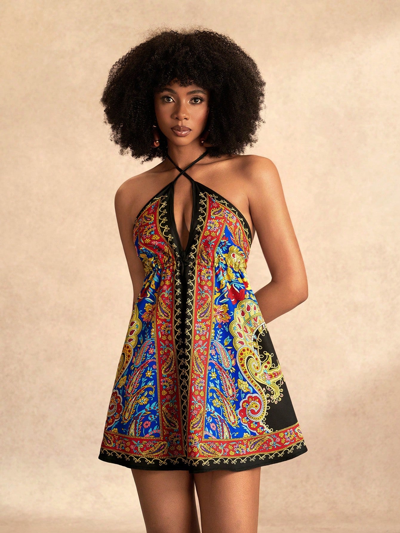Get ready to turn heads this summer in the Beach Festival Mini Dress! Featuring a trendy cross halter neck and a vibrant, eye-catching print, this dress is perfect for sunny days and lively nights. Its playful design keeps you cool and stylish, making it your go-to choice for festivals, beach outings, or casual hangouts. Embrace the fun and let your summer vibes shine!