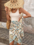 Front view of white scoop-neck bodice with cream paisley wrap mini skirt