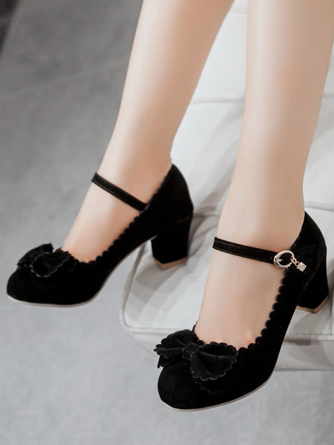 The Black Bow Decor Mary Jane Pumps combine style with comfort, featuring a scalloped trim and chunky heel. Expertly crafted, these pumps offer both elegance and support to your outfit. Elevate your look with these timeless and versatile shoes.
