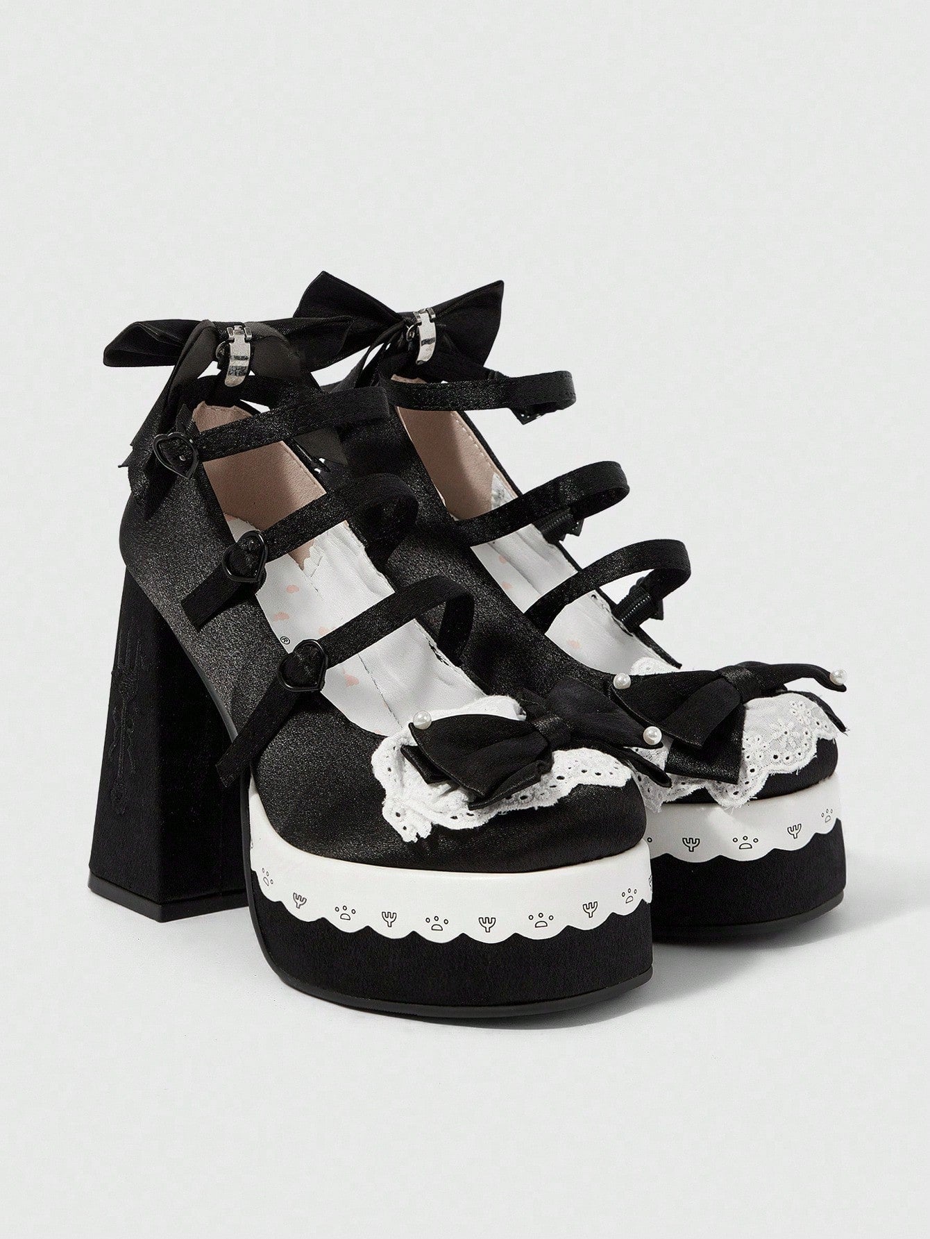 Step up your style game with these Black High Heel Mary Jane Shoes, a perfect blend of playful charm and gothic edge. Featuring a waterproof platform perfect for any weather, they boast a cute bowknot detail that adds a flirty twist. Whether you're dancing the night away or making a bold statement, these pumps deliver comfort and confidence with every step.