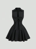 Black and white striped sleeveless mini dress with oversized bow