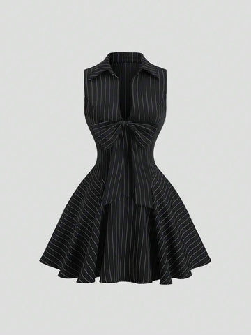 Black and white striped sleeveless mini dress with oversized bow