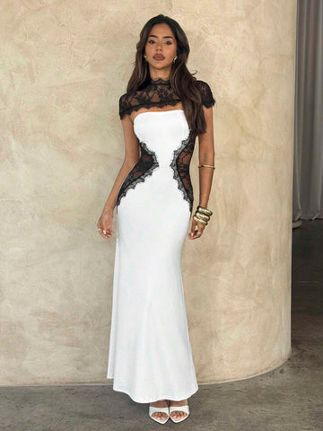Front view of black and white lace patchwork bodycon maxi dress with sheer high neck and cap sleeves
