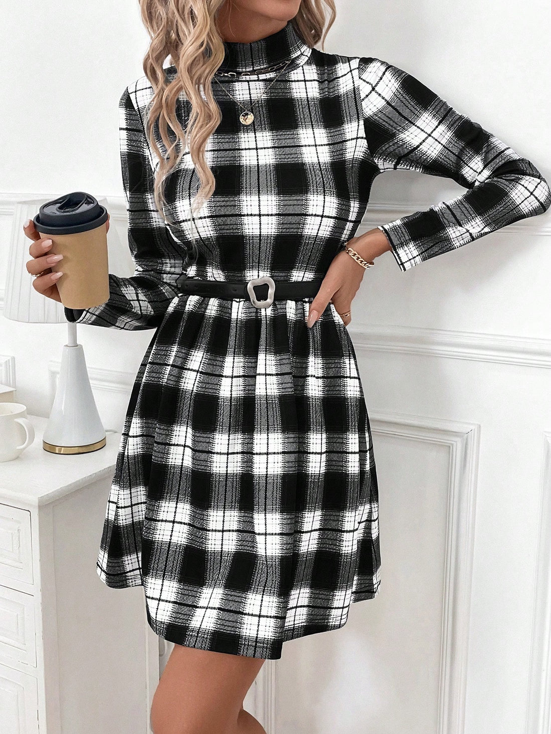 This Black and White Plaid Bodycon Dress is a timeless staple for both daily and professional wear. Made with a classic plaid pattern, this dress offers a versatile and chic look. Its bodycon fit flatters your figure while providing comfort and confidence. Perfect for any occasion, this dress is a must-have in your wardrobe.