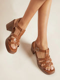 Elevate your seasonal wardrobe with these Block Heel Caged Strap Sandals for Women, a stylish combination of modern elegance and everyday comfort. Designed with an eye-catching caged strap silhouette and an open-toe design, these heels add a sophisticated finish to everything from flowy dresses and tailored pants to jumpsuits and denim.