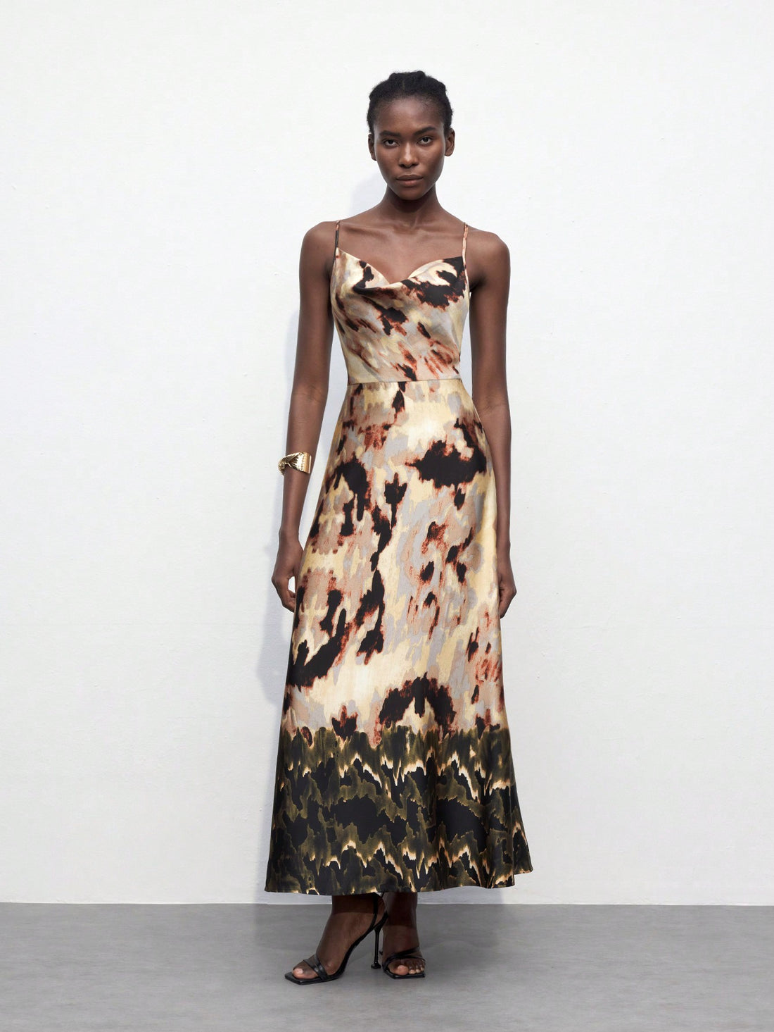 Introducing the Blooming Beauty dress - a must-have for any fashion-forward individual. This backless dress features a flattering draped neckline and a stunning floral print, perfect for any occasion. Elevate your style with this elegant piece.