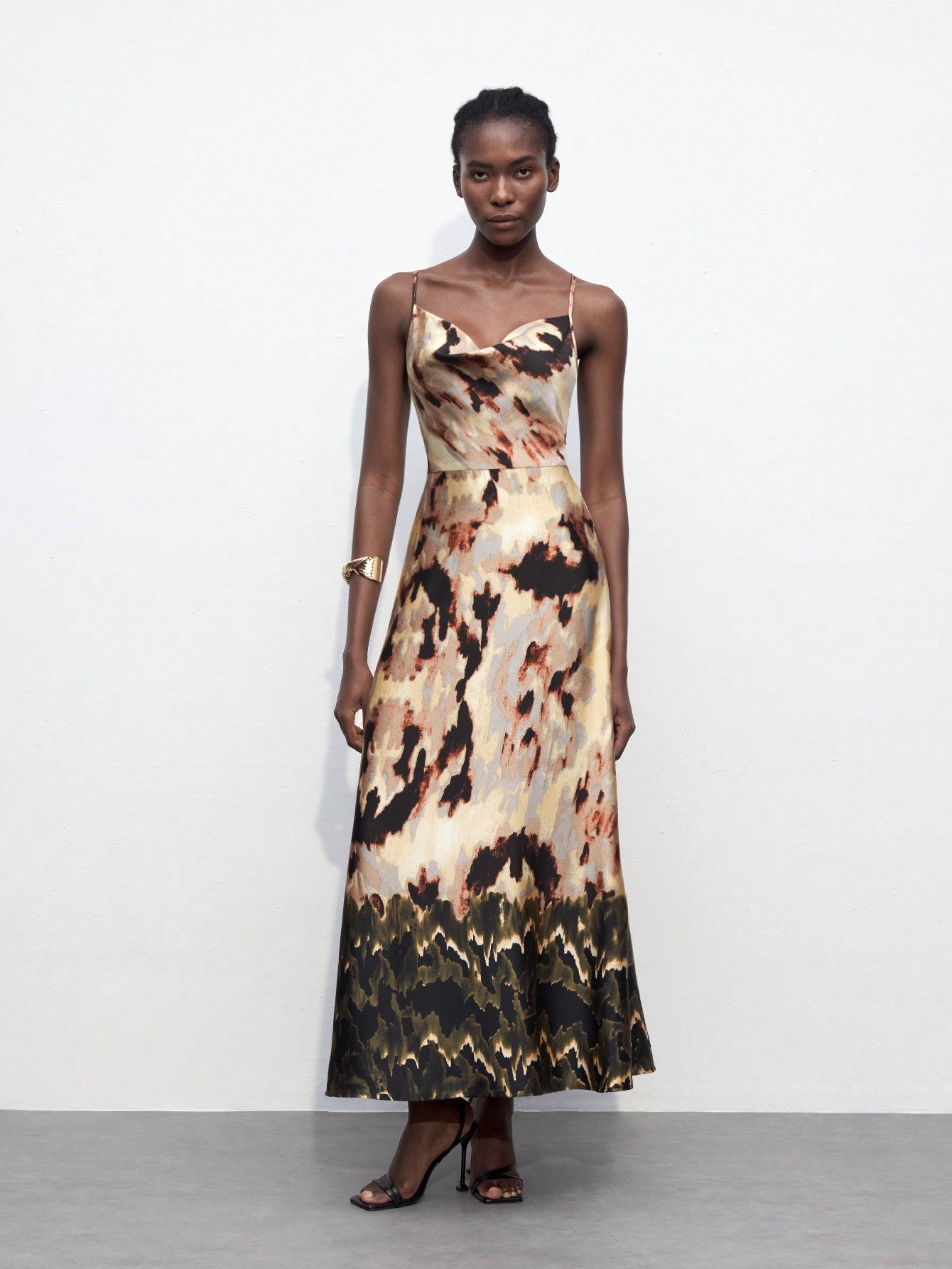 Introducing the Blooming Beauty dress - a must-have for any fashion-forward individual. This backless dress features a flattering draped neckline and a stunning floral print, perfect for any occasion. Elevate your style with this elegant piece.