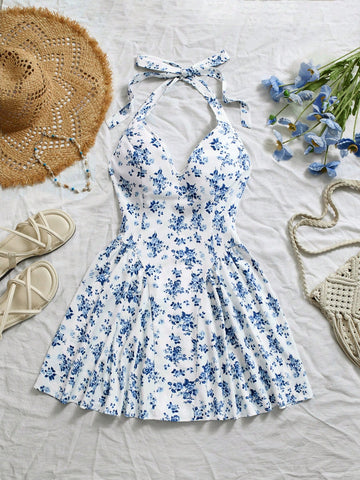 Be bold and flirty in this Blue Ditsy Floral V-Neck Backless Peplum Short Dress! Show off your feminine side with a charming floral print, plunging v-neck, and playful peplum skirt. The backless design adds a touch of sass to this already stunning dress. Perfect for a night out or special occasion.