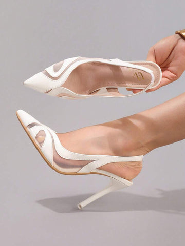 Top side view of white pointed toe pumps with open back strap and beige insole