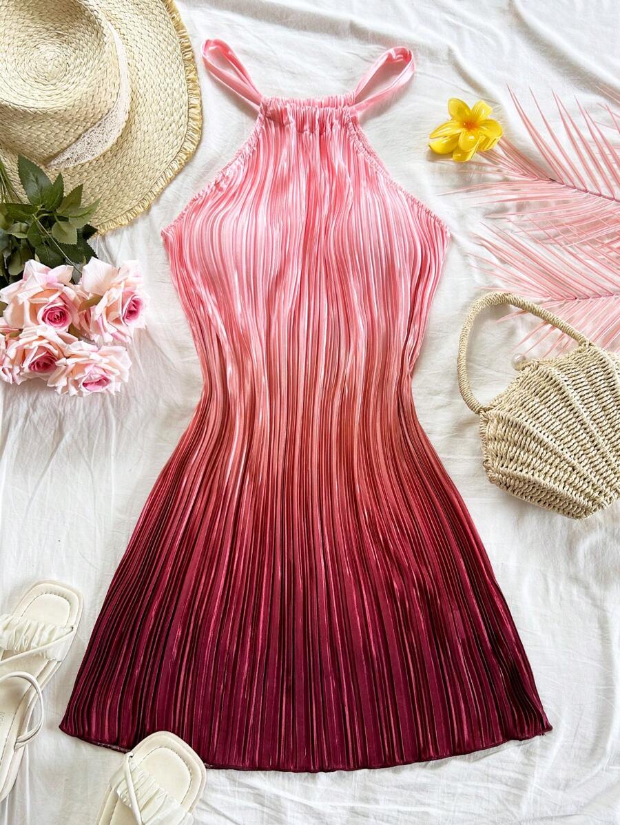 Elevate your warm-weather wardrobe with this stunning blue ombre pleated mini dress. Featuring a flattering halter neckline and high-waisted A-line silhouette, this sleeveless cami-style dress transitions effortlessly from beach days to festival nights. The all-over print design and flared hem create movement and visual interest, while the slim fit offers a polished look. Crafted from 100% polyester knitted fabric with a semi-sheer finish, this unlined piece is easy to care for with simple machine washing. 