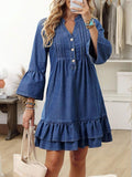 Front view of washed-blue denim mini dress with pintuck bib and double ruffle hem for casual wear
