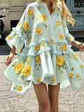 Front street view of mint floral bell-sleeve mini dress with tiered high-low ruffle hem