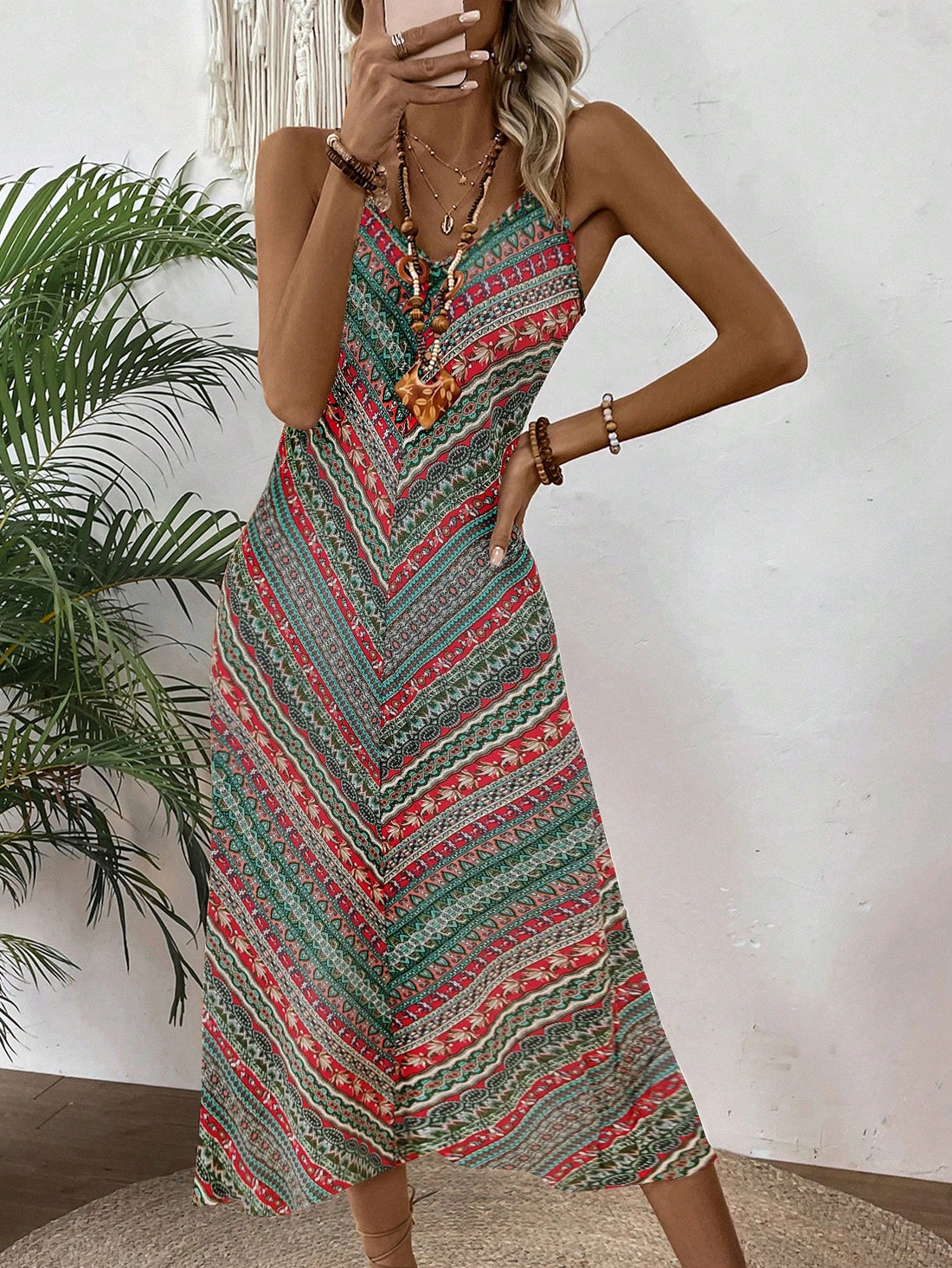 Effortlessly embody vacation style with Bohemian Bliss: Floral Printed V-Neck Spaghetti Strap Maxi Dress. Featuring a beautiful floral print, a flattering V-neckline, and delicate spaghetti straps, this dress is perfect for your next getaway. Stay cool and comfortable while looking effortlessly chic.