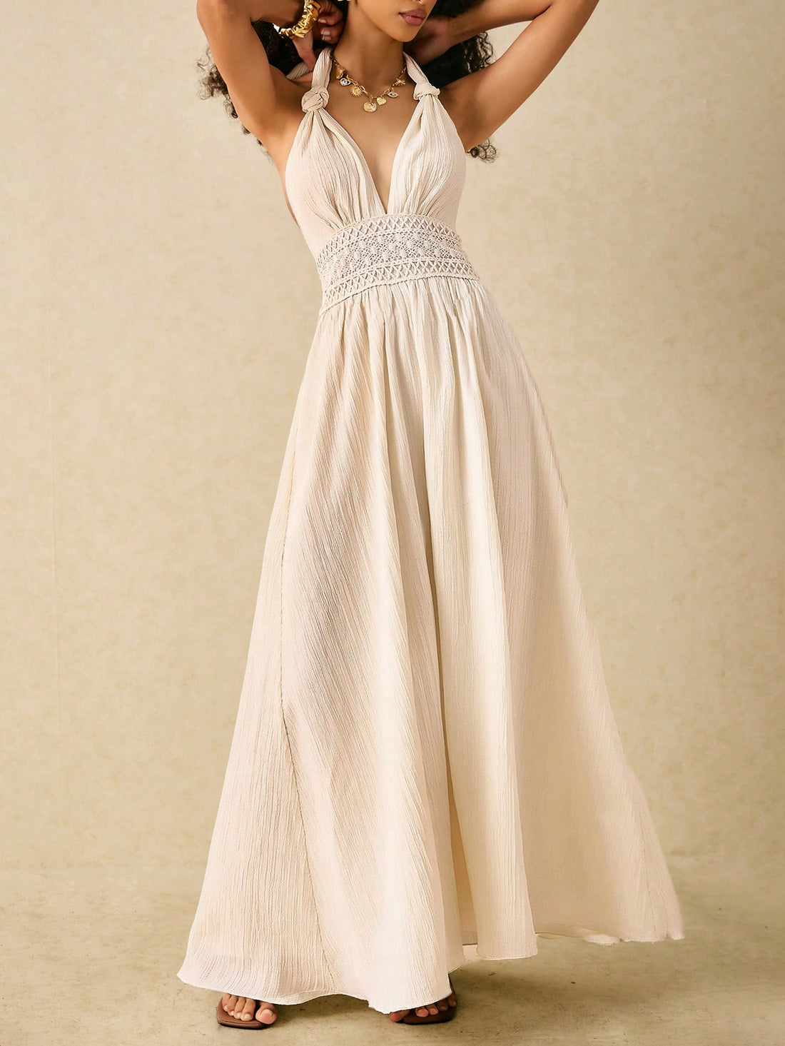 Embrace effortless beach elegance with Bohemian Bliss! This flowy halterneck maxi dress features intricate lace detail, perfect for achieving a boho chic look. Soak up the sun in style and comfort with this must-have addition to your summer wardrobe.