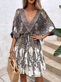 Get ready to embrace your inner bohemian with our Bohemian Bliss dress! Made with a playful paisley print, this dress features batwing sleeves and a ruffle trim. And don't forget the tassel tie for a touch of whimsy. Perfect for any carefree, boho-chic style!