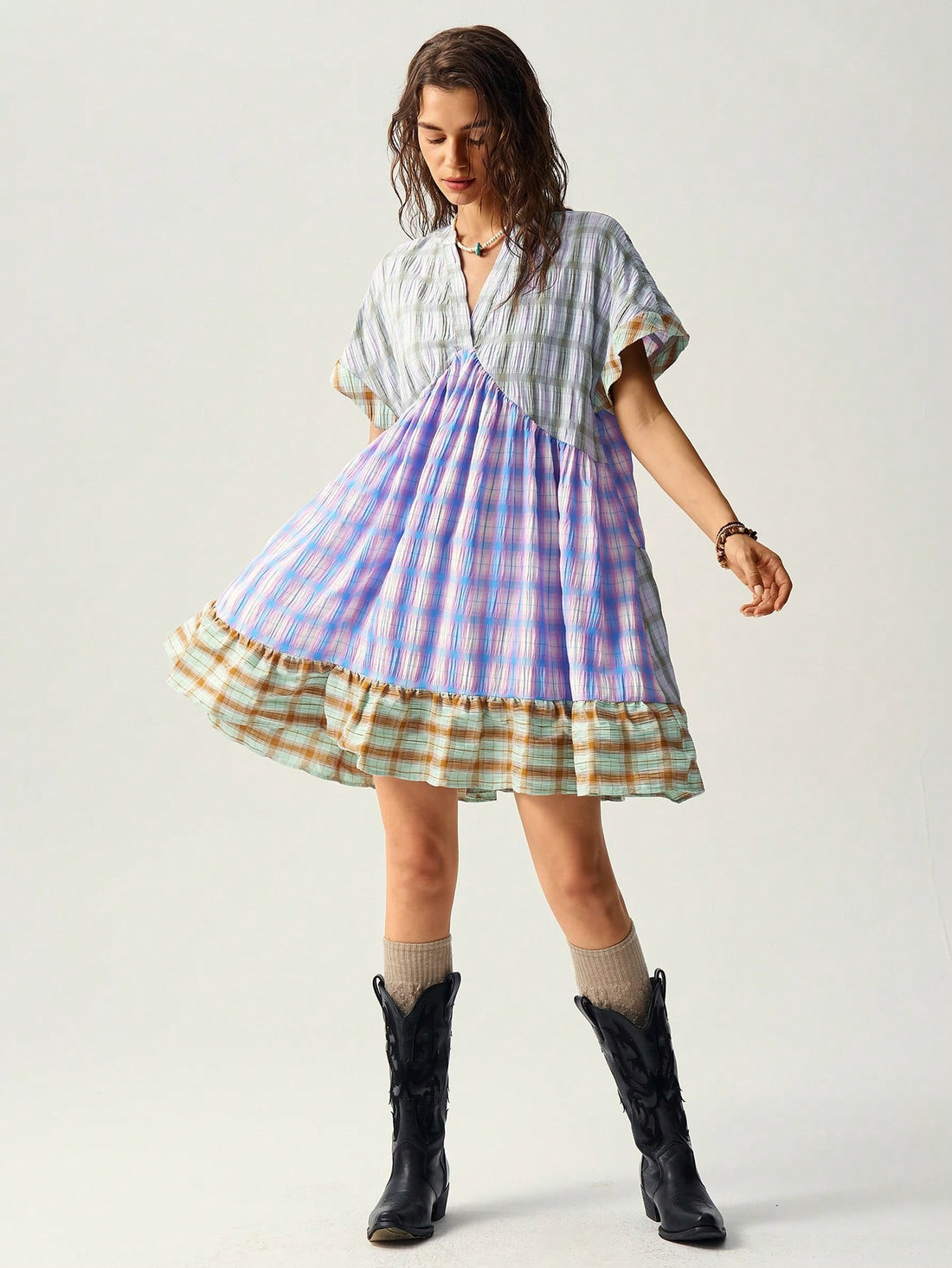 Add a pop of color to your summer with the Bohemian Bliss dress. Vibrant multicolor checkered patchwork creates a playful yet chic look. Perfect for any occasion - dress it up for a night out or keep it casual for a day at the beach. Get your boho vibe on!