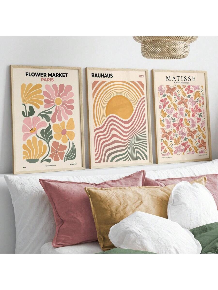 Bedroom view of floral Bauhaus and butterfly canvas posters in wood frames