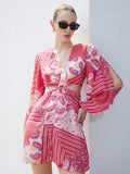 Step into summer with this playful Bohemian Chic chiffon mini dress, featuring airy lantern sleeves and a vibrant abstract print. Perfect for elegant vacations, its lightweight fabric keeps you cool while the unique design adds a fun, stylish flair to your sunny adventures.