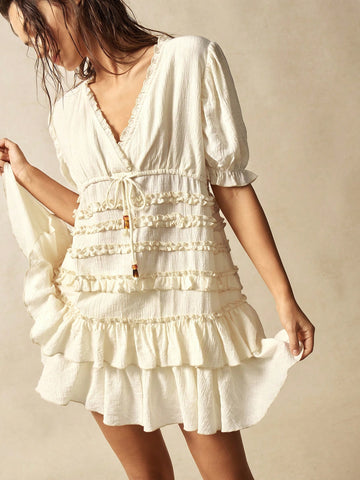Step into effortless style with this Bohemian Chic mini dress. Featuring a flattering V-neck and short sleeves, it’s perfect for sunny days and casual outings. The playful ruffled hem adds a flirty touch that moves with you. Light and breezy, this dress is designed for fun, comfort, and easygoing moments wherever your day takes you.