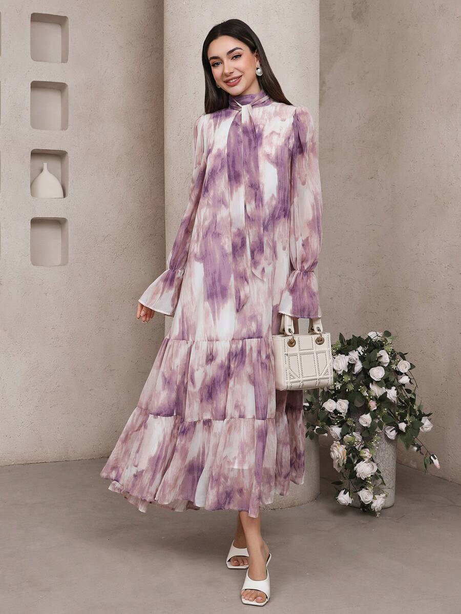 Embrace carefree vibes with this Bohemian Chic dress featuring dreamy tie-dye patterns, playful flare sleeves, and a flirty ruffle hem. Perfect for dancing through your day or adding instant style to any casual outing, it’s your go-to for effortless, breezy charm.