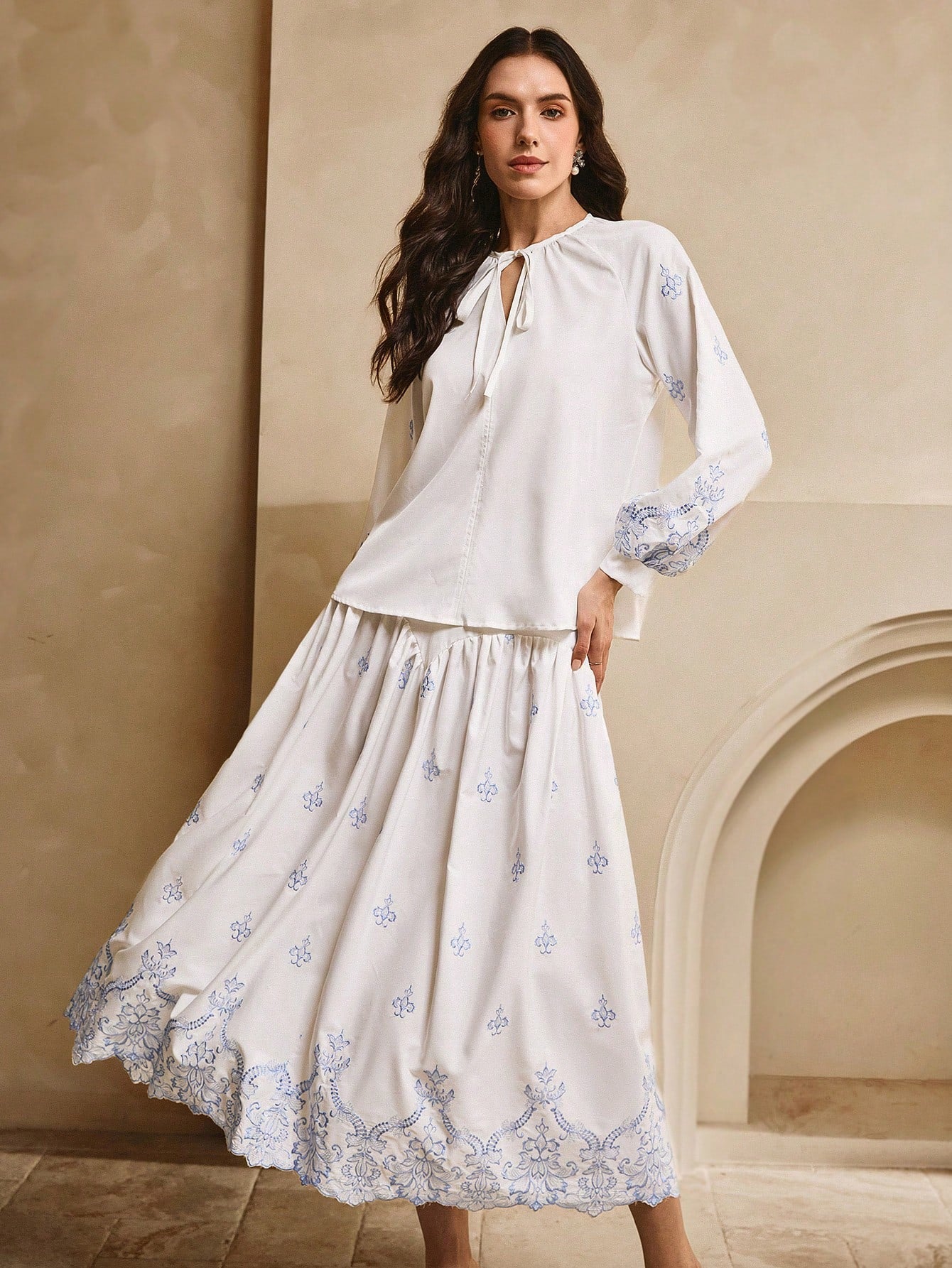 Experience the epitome of bohemian elegance with our 2-piece set featuring a crisp white base and a stunning blue embroidered top and skirt. Perfect for those seeking a unique and playful look. (Effortlessly exude style and charm with this versatile set!)