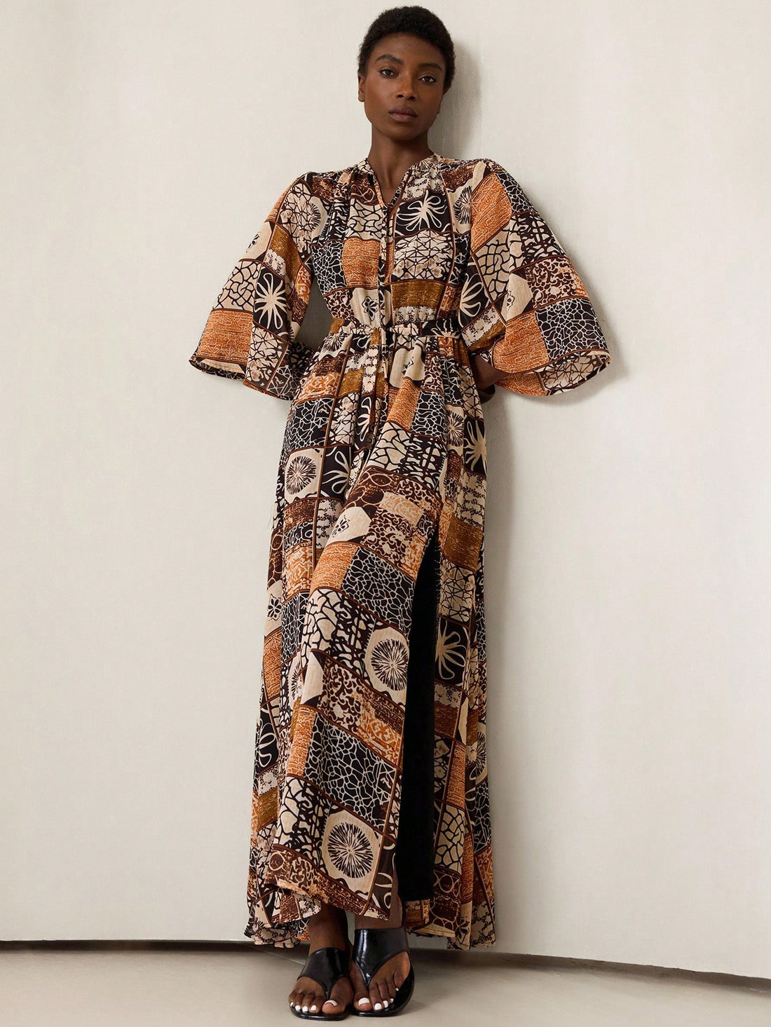 Step into effortless charm with this Bohemian Elegance midi dress. Featuring a flirty high-low hem that dances with every step and a chic stand collar, it’s designed to highlight your waist with a flattering cinch. Perfect for twirling at festivals or turning heads on casual days, this dress brings playful sophistication to your wardrobe. Embrace the breezy freedom and stylish flair all in one beautiful piece!