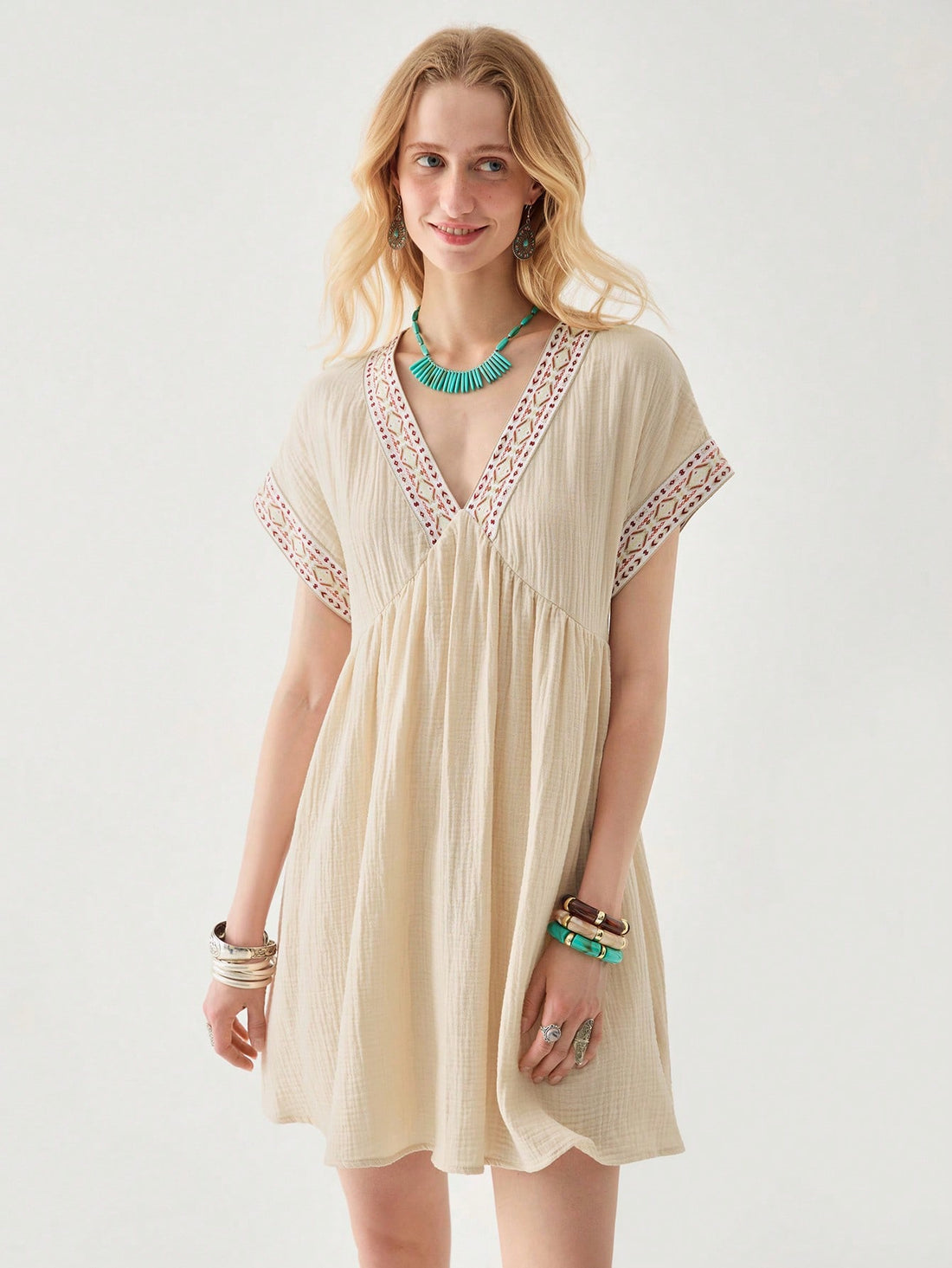 Embrace your free spirit in this playful V-neck midi dress! Delicate embroidery adds a touch of bohemian charm, while the casual silhouette keeps you comfortable from beach strolls to sunset dinners. Pack this versatile vacation essential and let your carefree style shine wherever your adventures take you!