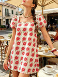 Front view of cream floral square neck mini dress with coral blooms and puff sleeves